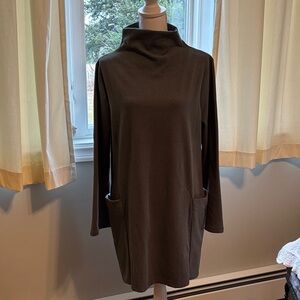 Olive Green Long Sleeve Dress with large wrap side pockets and flaired sleeves.